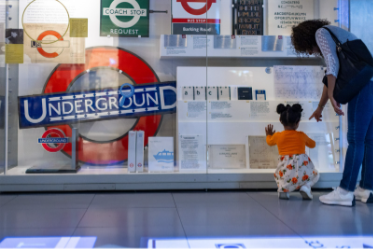 Visitors looking at Underground displays at London Transport Museum