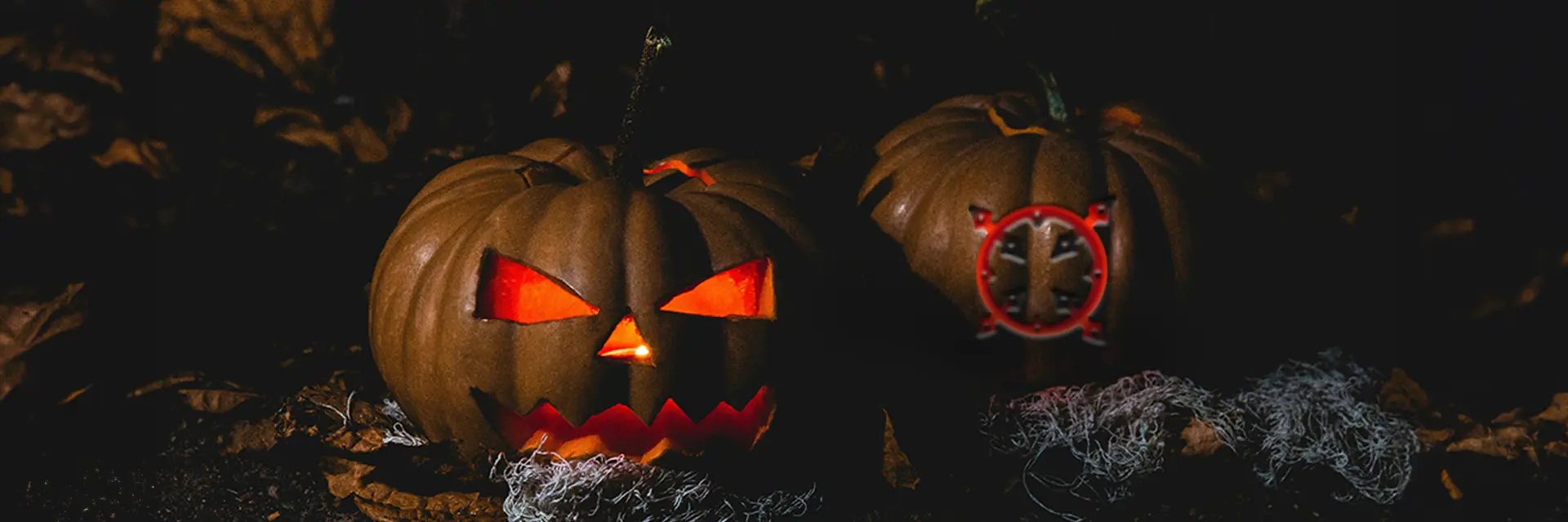 Illuminated Halloween pumpkins, including a pumpkin carved with the Bodmin Jail logo